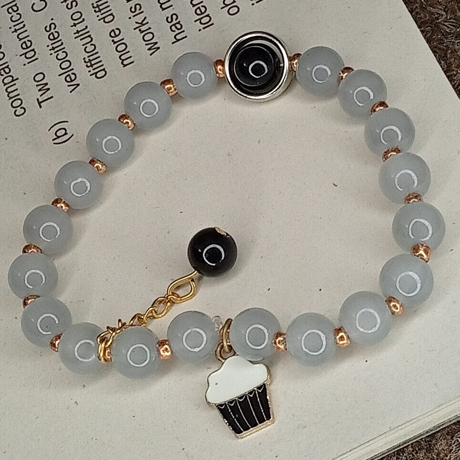 Sweet Indulgence: Serene Grey & Cupcake Charm Bracelet