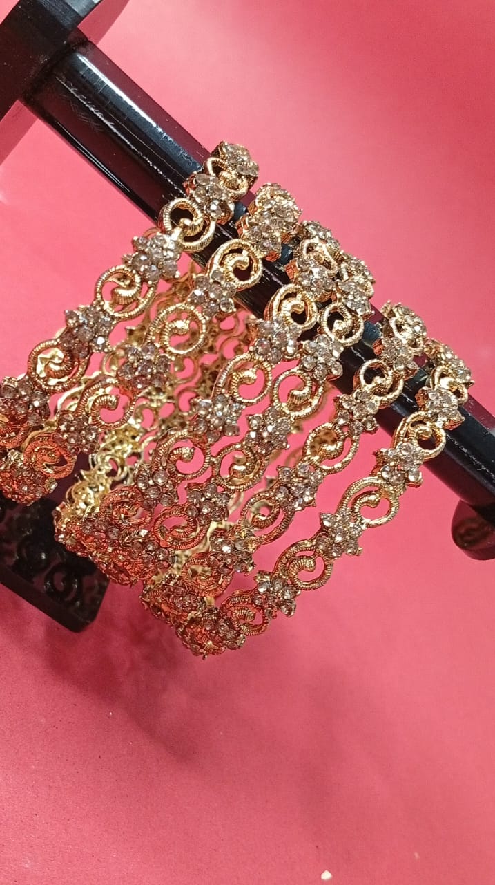 gold-tone stone-studded filigree bangles set