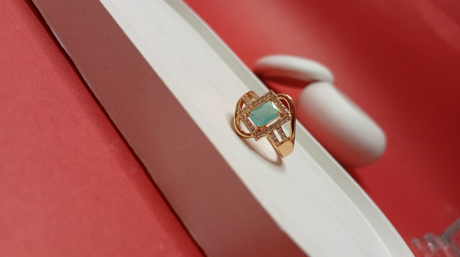 the gold-tone geometric turquoise ring