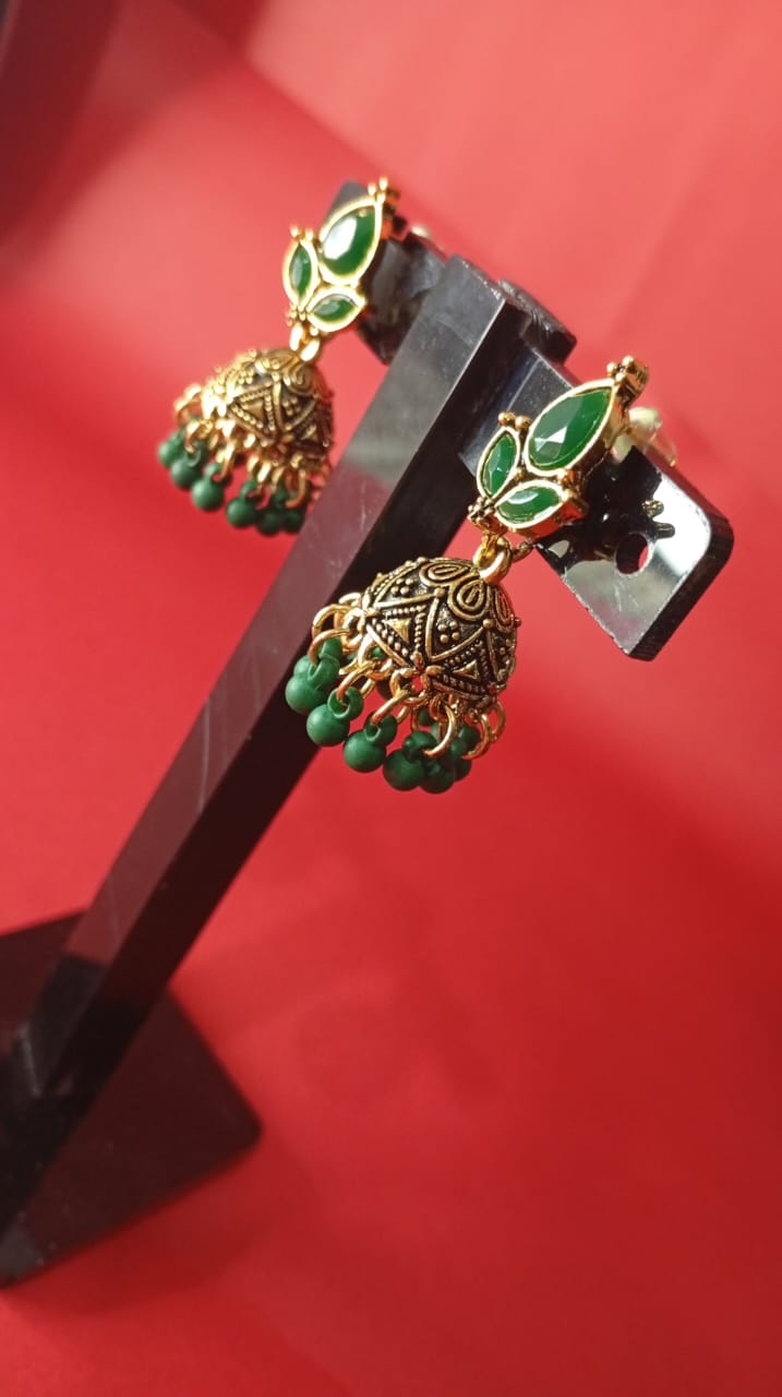 the gold-tone green stone jhumka earrings