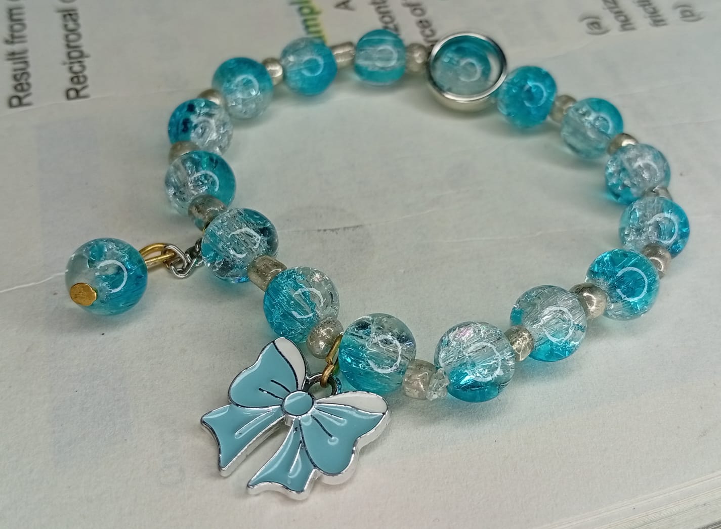 Aqua Crackled Glass Beaded Bracelet with Light Blue Bow Charm