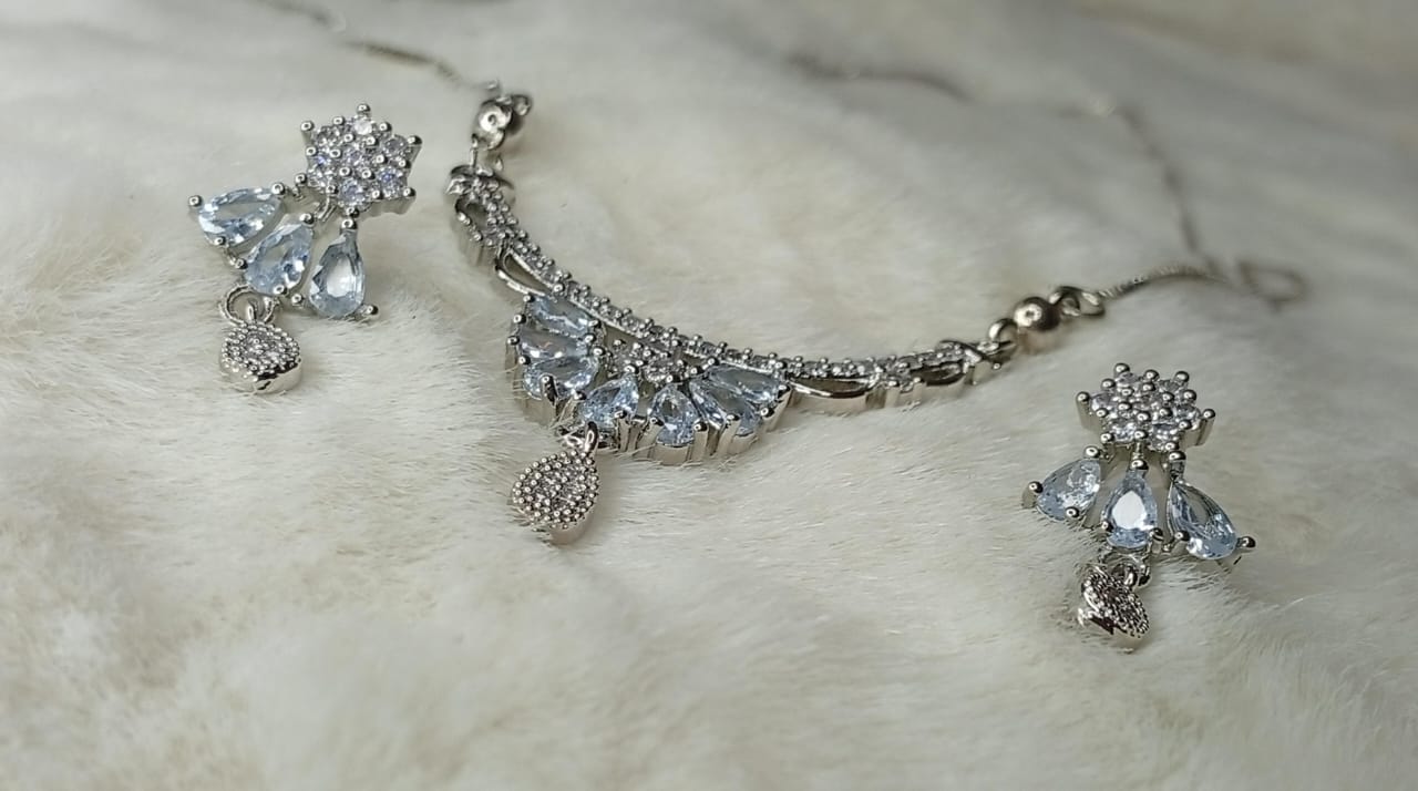 Elegant Sterling Silver Finished Necklace Set with Pear-Cut Aquamarine Zirconia & Floral Accents | Includes Matching Drop Earrings | Bridal & Occasion Jewelry